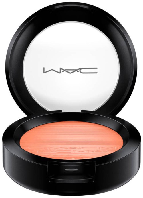 A round black container with orange blush inside, and a white lid with MAC logo on the inside.