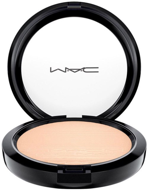 A compact with pressed powder, black case, and MAC logo inside the lid.