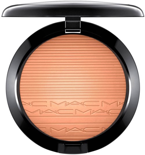 Round makeup compact with peach-colored powder and MAC logo embossed.