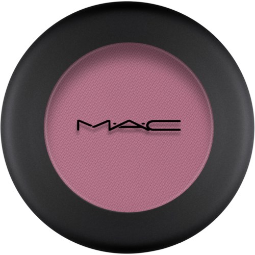 A round makeup blush with a black outer case and pink center, featuring the MAC logo in black.