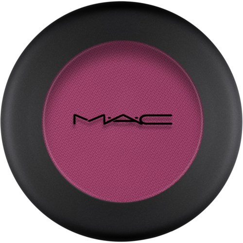 Round pink makeup blush with black border and MAC logo in black in the center.