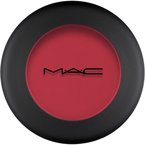 Red makeup product with black outer case and MAC logo in the center.