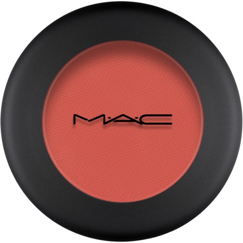 A round blush with a black border and the MAC logo in the center.
