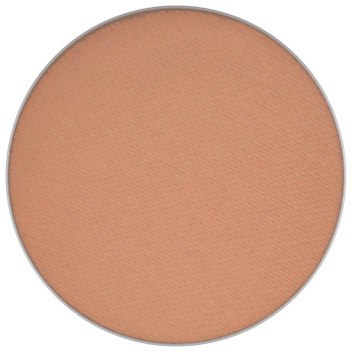 A round makeup powder compact with a peach-colored shade inside.