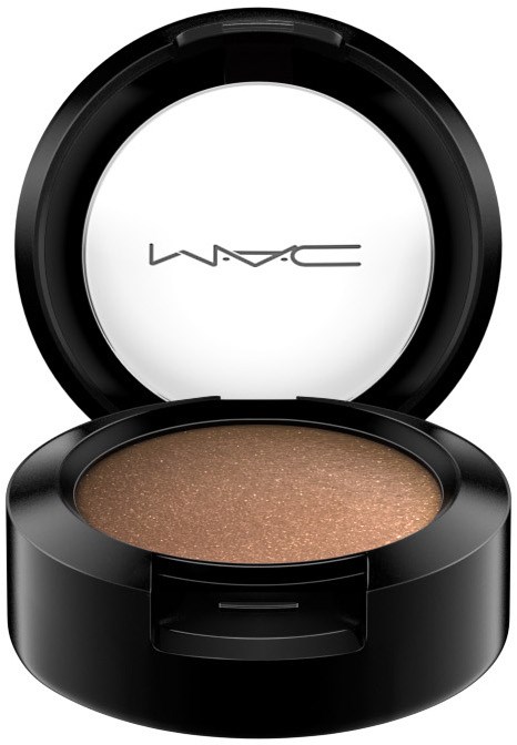 En makeupkompakt med skimrande ögonskugga i beige-brunt och ett svart runt fodral.