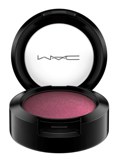 Pink eyeshadow in a round black container with open lid, MAC logo on mirror.