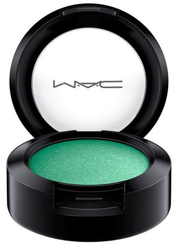 A round green eyeshadow in a black compact case with a mirror inside the lid.