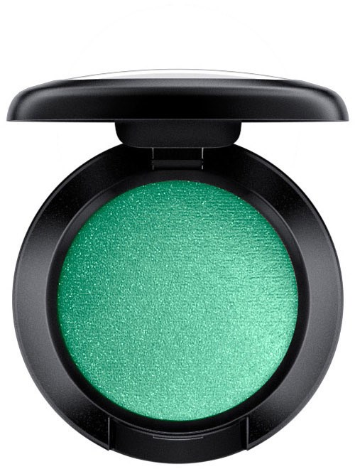 A round green eyeshadow in a black compact with a lid.