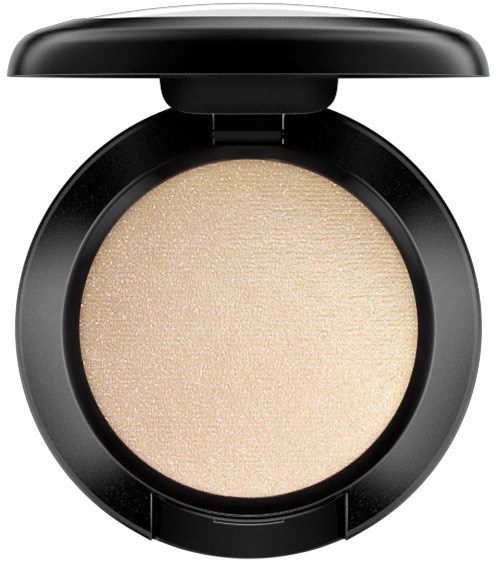 Round makeup compact with beige powder inside, black case, and open lid.