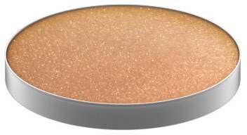 A round makeup eyeshadow palette with a shimmery beige color inside.