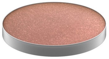 A round, flat makeup product with a glittery, light pink shade in a silver case.