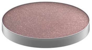 A round, metallic container holds glittery pink makeup or product. The surface sparkles with tiny shiny particles.