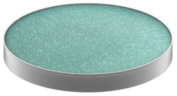 A round, flat object with a light green, speckled surface and a silver edge.