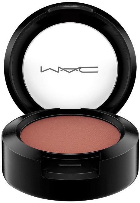 A round makeup compact with blush inside and a brand name MAC on the inner lid.