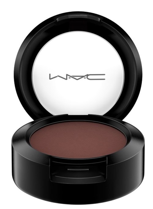 A round makeup blush in a black compact with a mirror inside the lid.