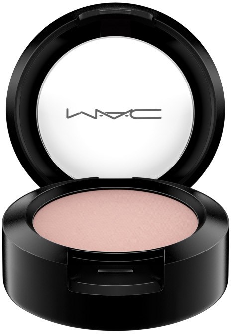A round black makeup compact with a white powder inside and MAC logo on the inside lid.