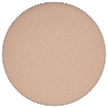 A round, beige makeup press with a smooth surface, likely pressed powder. No additional details or markings are visible.