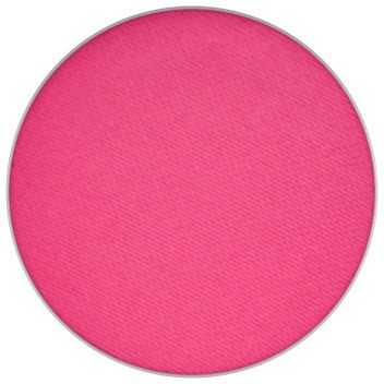 En rund rosa makeup-rouge med matt yta och slät yta.