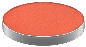 A round, orange-red makeup blush or powder with a silver edge. No other objects visible.