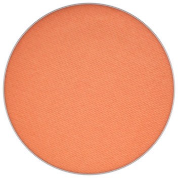 En rund, orange rouge-compact med slätt, matt yta. Inga synliga fall eller märkesdetaljer.