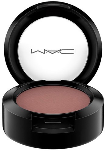 A round black makeup container with blush inside and MAC logo on the inside of the lid.