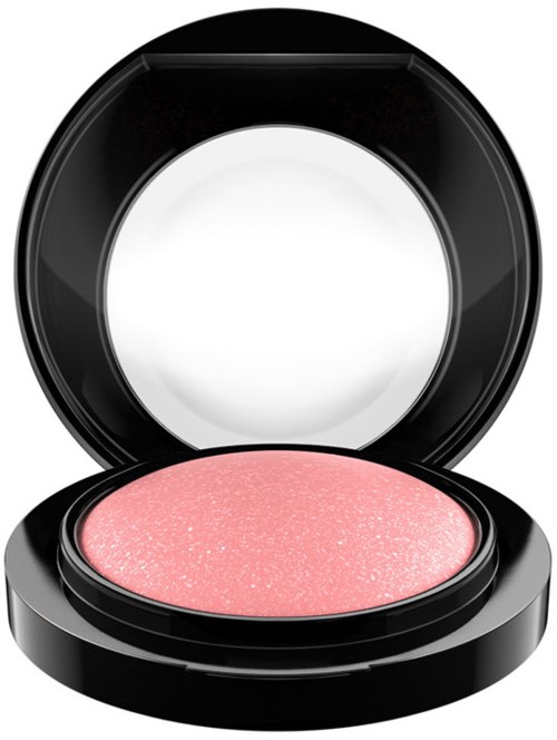 Pink glittery eyeshadow inside a round black compact with mirror.