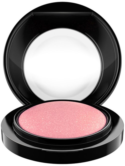 A pink eyeshadow with glitter in an open black round makeup compact.