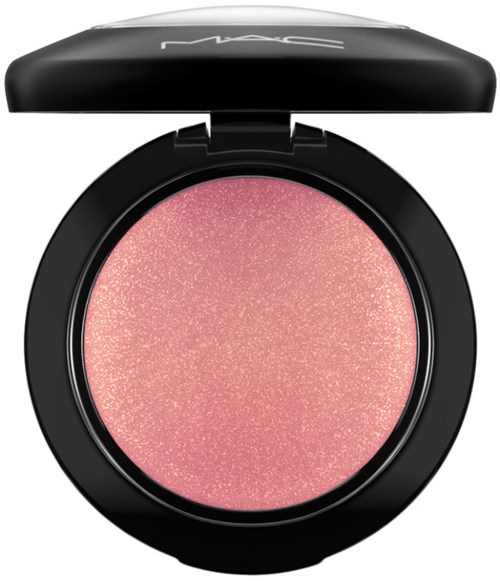 A pink, shimmery blush in a black compact with an open lid, branded by MAC.