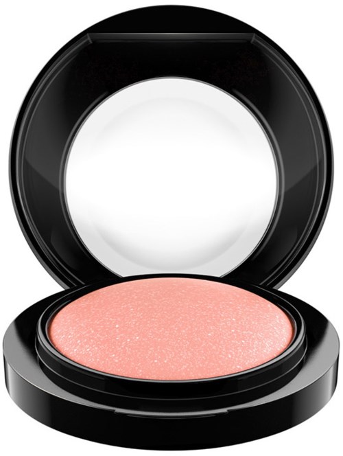Runder Make-up-Compact mit rosa Rouge im Inneren, offenbarer Produkt.