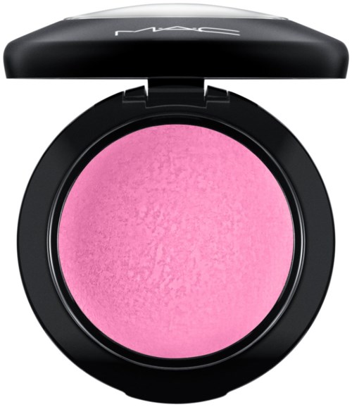 A round pink blush in a black compact with a partially open lid.品牌 logo visible on lid.
