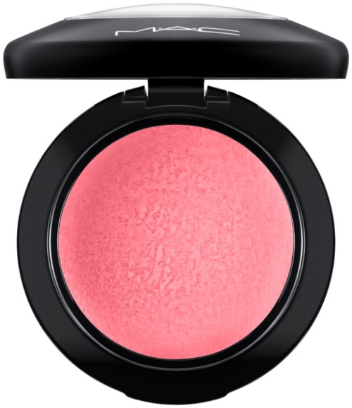 A round pink blush inside a black compact with a lid labeled 'MAC'.