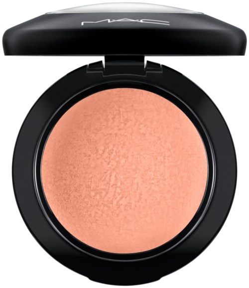 A round blush compact with a black lid that has the MAC logo on top.