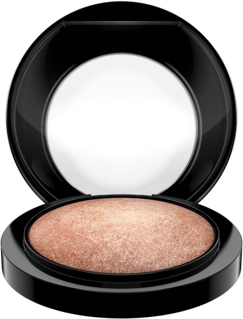 A round makeup compact with a beige, shimmery powder inside and a black lid.