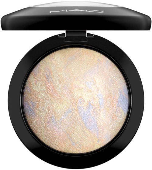 A round, shimmering highlighter in a black compact case, with a slightly open lid on top.