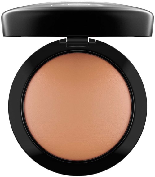 A round compact with beige powder and a black lid, designed for makeup application.