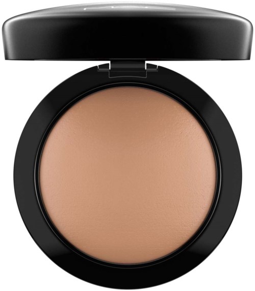 A compact with a beige powder inside, open lid, round shape, black case, smooth surface.