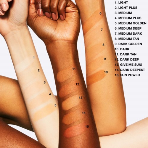 Swatch of various foundation shades labeled from light to sun power on skin arms.