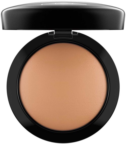 A compact with beige pressed powder and a black lid. It looks like makeup foundation or blush.