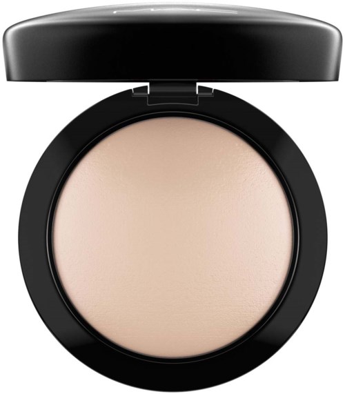 A compact cosmetics container with light-colored pressed powder inside and a black lid.