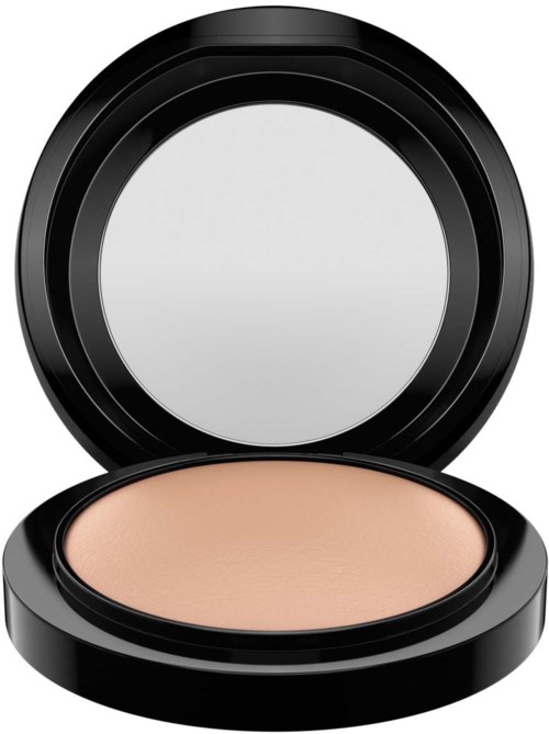 A round compact with beige makeup, open lid revealing mirror and product.