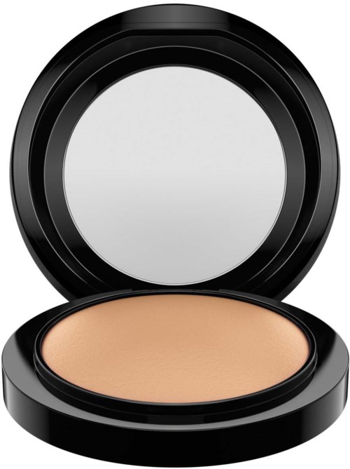 A black compact with a mirror contains skin-colored powder.