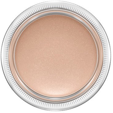 A round container with a beige, shimmery cosmetic product inside, seen from above.