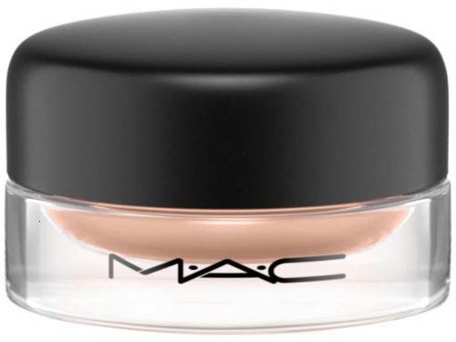 A small jar of makeup with a black lid and clear body, labeled MAC, with peach-colored product inside.