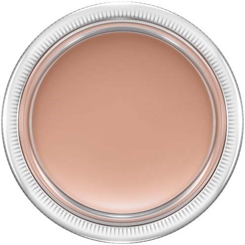 A round container with a lid, filled with beige-colored cream or makeup product.