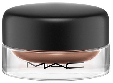 En liten, rund behållare med svart lock, genomskinlig botten och MAC-loggan på framsidan.