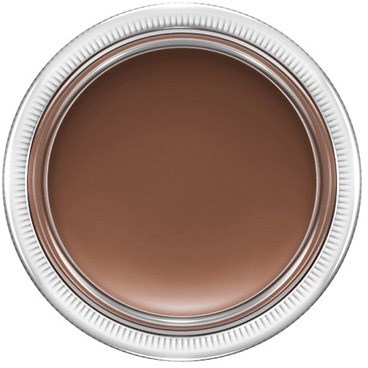 En rund behållare fylld med brunt kräm, möjligtvis makeup eller mat.