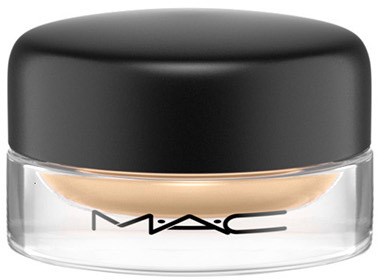A small, round MAC makeup container with a black lid and transparent base showing beige product inside.