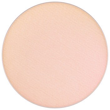 A round, peach-colored makeup compact with a smooth, matte surface and no visible brand or design.