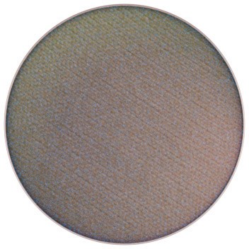 A circular eyeshadow with a shimmery, multicolored surface in shades of brown and gold.