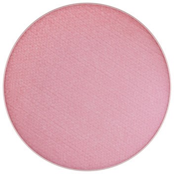 A round, pink makeup blush or powder with a textured surface.